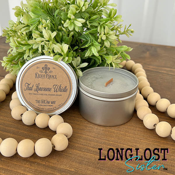 that lonesome whistle wooden wick candle  sweet tobacco leather musk sandalwood bergamot scent long lost sister boutique